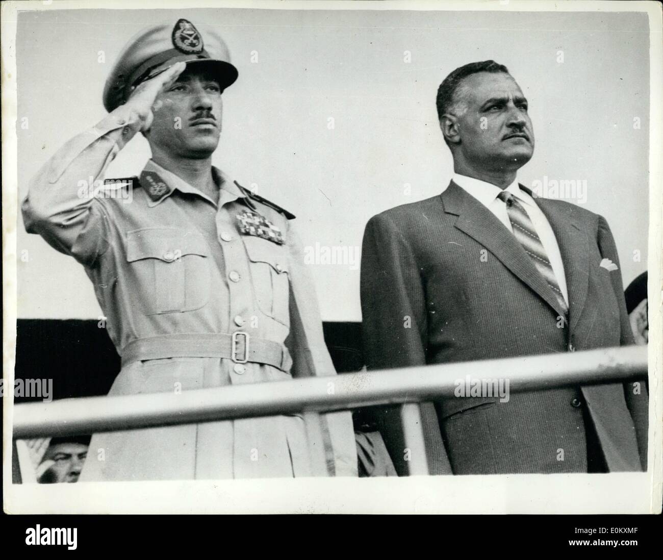 Jul. 07, 1952 - Nasser Shows off his Rockets in Cairo. Takes salute at Anniversary March Past: Egyptian rocket were the centre piece of the recent Military Parade through the streets of Cairo held to celebrate the 10th. Anniversary of the Revolution. The rockets - 'Conqueror' with a range of 400 miles and the Victor (range of 250 miles) - are, according to President Nasser - now under mass production in Egypt. Observers were quick to note that the rockets brought Israel within range of Egypt. Photo shows President Nasser accompanied by Field Marshal Abdul Hakim Amir C.I.C of the U.A Stock Photo