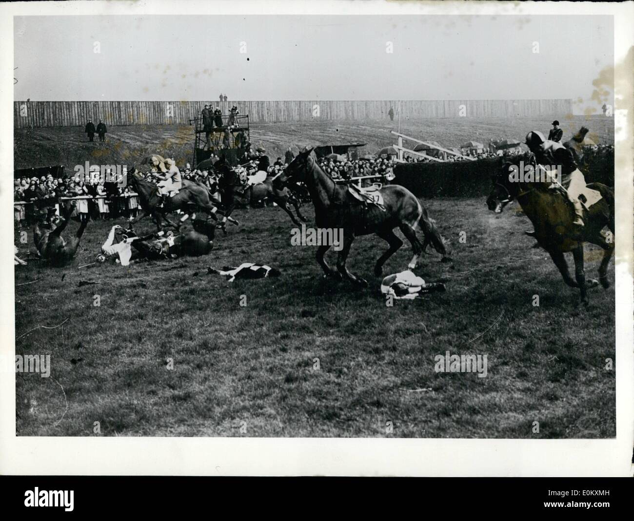 Jul. 07, 1952 - At the ''Grand National'' held in Aintree, there was a massive pile up and many of the jockeys ended up on the ground. Funeral of German author Thomas Mann. Stock Photo