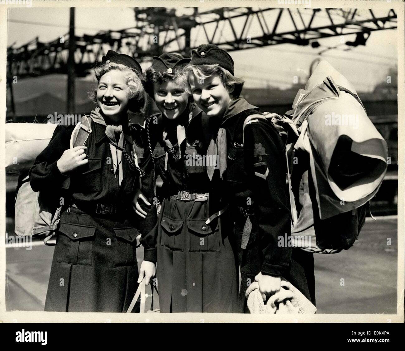 Aug. 08, 1952 - Norwegian Girl Guides Arrive In London For International Camp: A party of Norwegian Girl Guides who have been staying at Ipswich for the past few days - arrived in London this morning on way to the International Guide Camp at Beaconsfield. Photo shows L-R:- Astri Perring (17) of Oslo; Astrid Jacobsen (16), Oslo and Ase Guterdrum, Oslo - seen with their packs at Liverpool Street Station this morning. Stock Photo