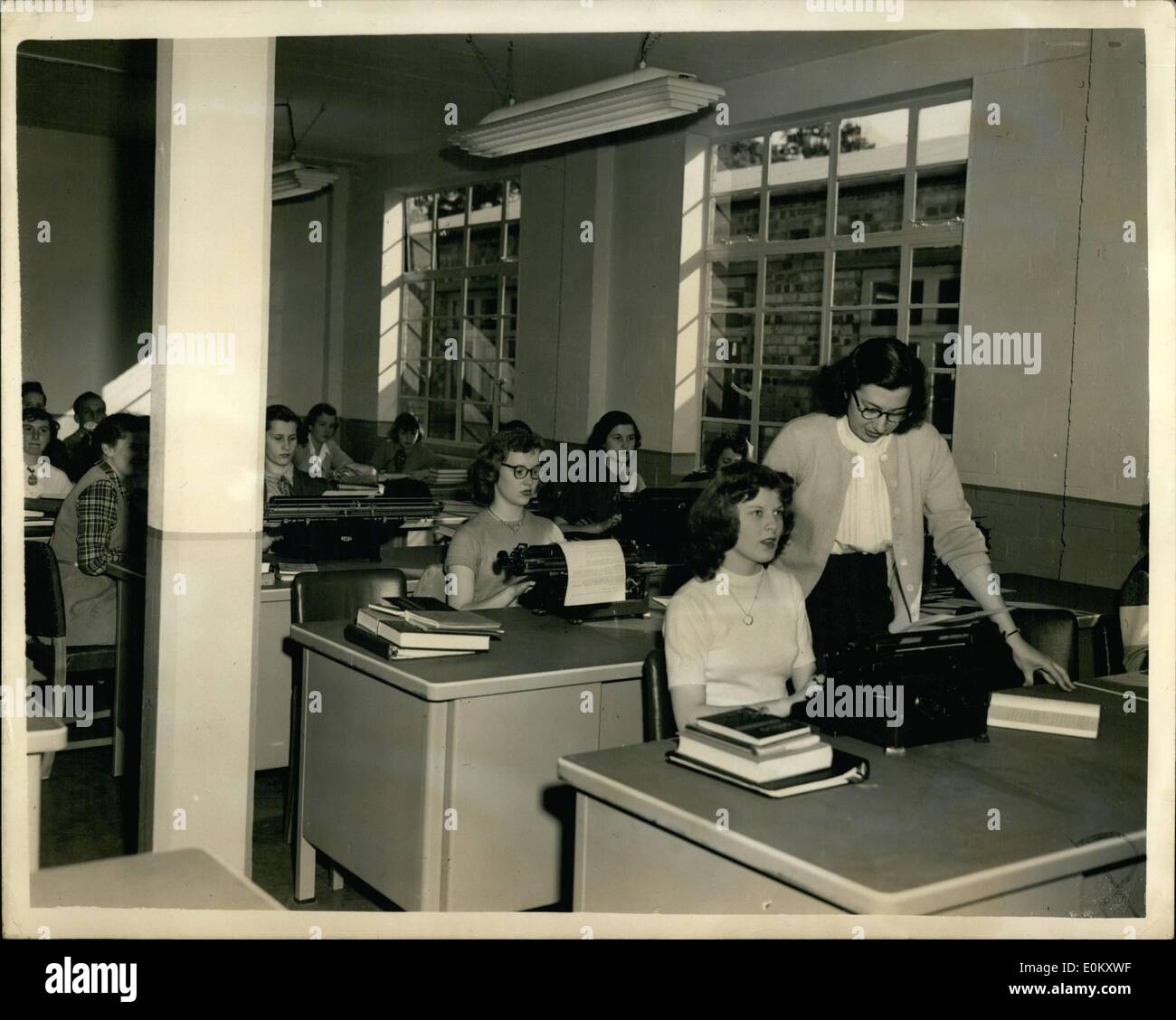 Oct. 10, 1952 - School for children of American Servicemen in Britain. Algebra teacher from Scotland: A typical American co-educational school has been opened at Bushey park, Twickenham for the children of American servicemen in Britain. It is a typical American High School, complete with Campus and baseball pitch. The children board at the school and the teachers come from many parts of the United States. Photo shows General view of the Typewriting Class at the School this morning. Stock Photo