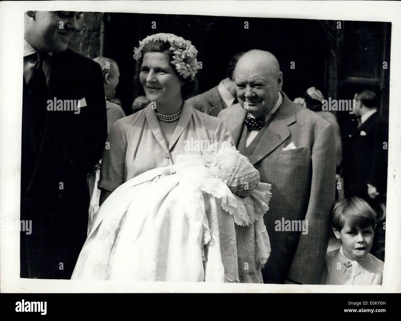 Aug. 17, 1952 - Churchill's Grandson chirstened: Mr. Winstons Churchill's eight grandchild, the two months old son of Captain and Christopher Soames and his wife Mary, daughter of Mr. Churchill, was christened today at Westerham Parish Church. One of the baby's names is Bernard, in honor of Viscount Montgomery who was a grandfather and the other is Jeremy, by which he will be known. Photo shows Mr. Winston Churchill and his daughter May, who is holding her son, after the christening today. Stock Photo