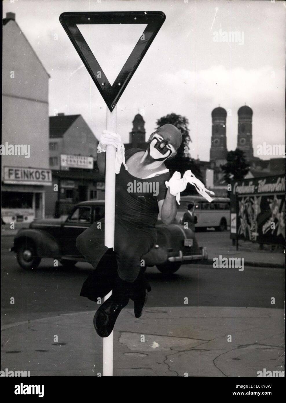 Sep. 01, 1952 - Charlie Rivel in Munich: For the first time after 11 years the well known clown Charlie Rivel returns again to the variety. He selected Munich as the first place of his programme after return to variety again. Picture shows Charlie studying the traffic sign in a Munich street. Stock Photo