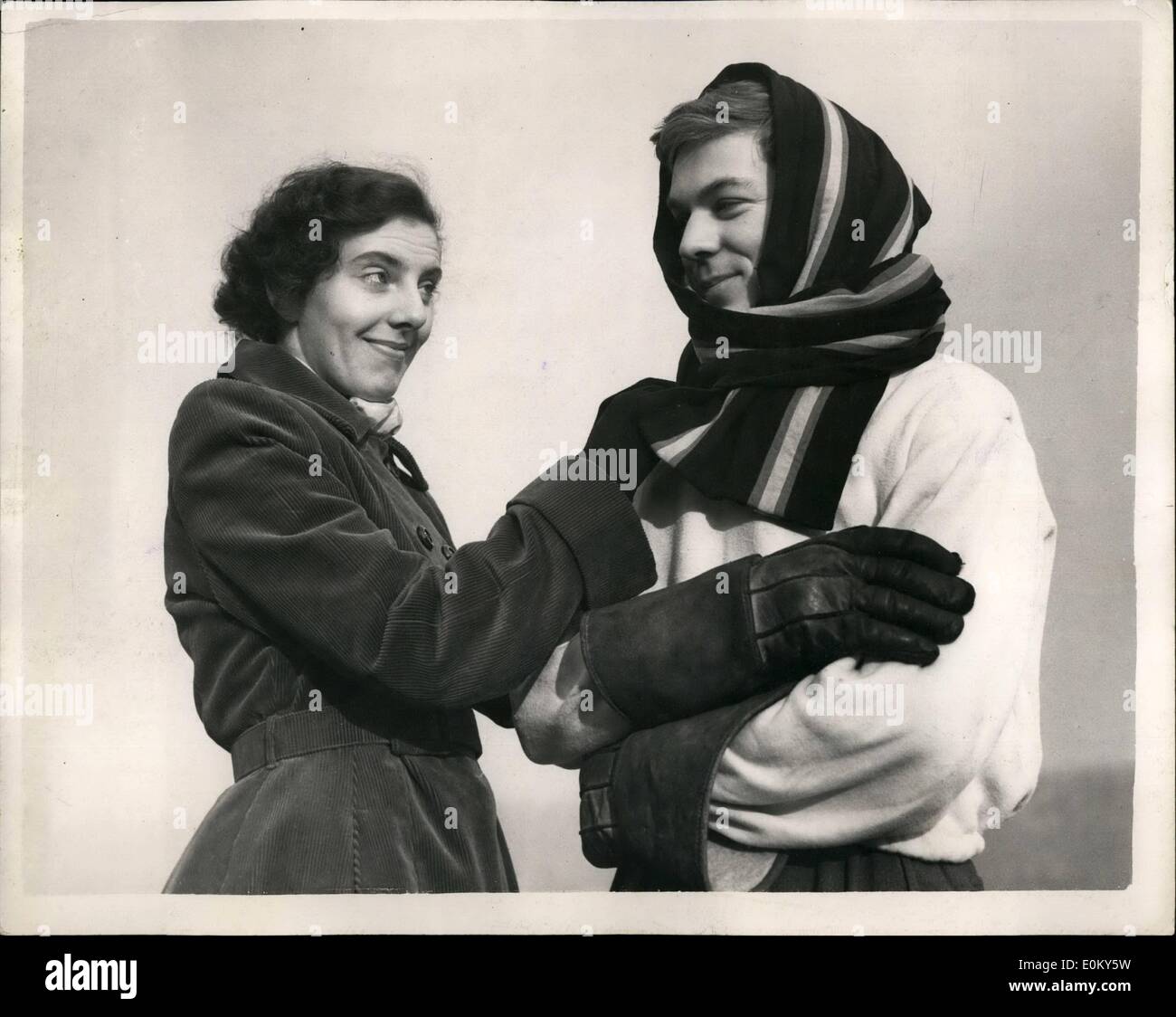 Nov. 11, 1952 - Hospitals Regatta at Putney. The Winning Cox: Forty two crews and scullers from London hospitals are taking part in their annual regatta being held on the Thames today from the Thames R.C. Boathouse at Putney. Photo shows Miss Hazel Bridget puts a scarf around the head of D.S. Porter (Cox) of the St. Thomas's Hospital crew which had just won their heat at Putney today. Stock Photo