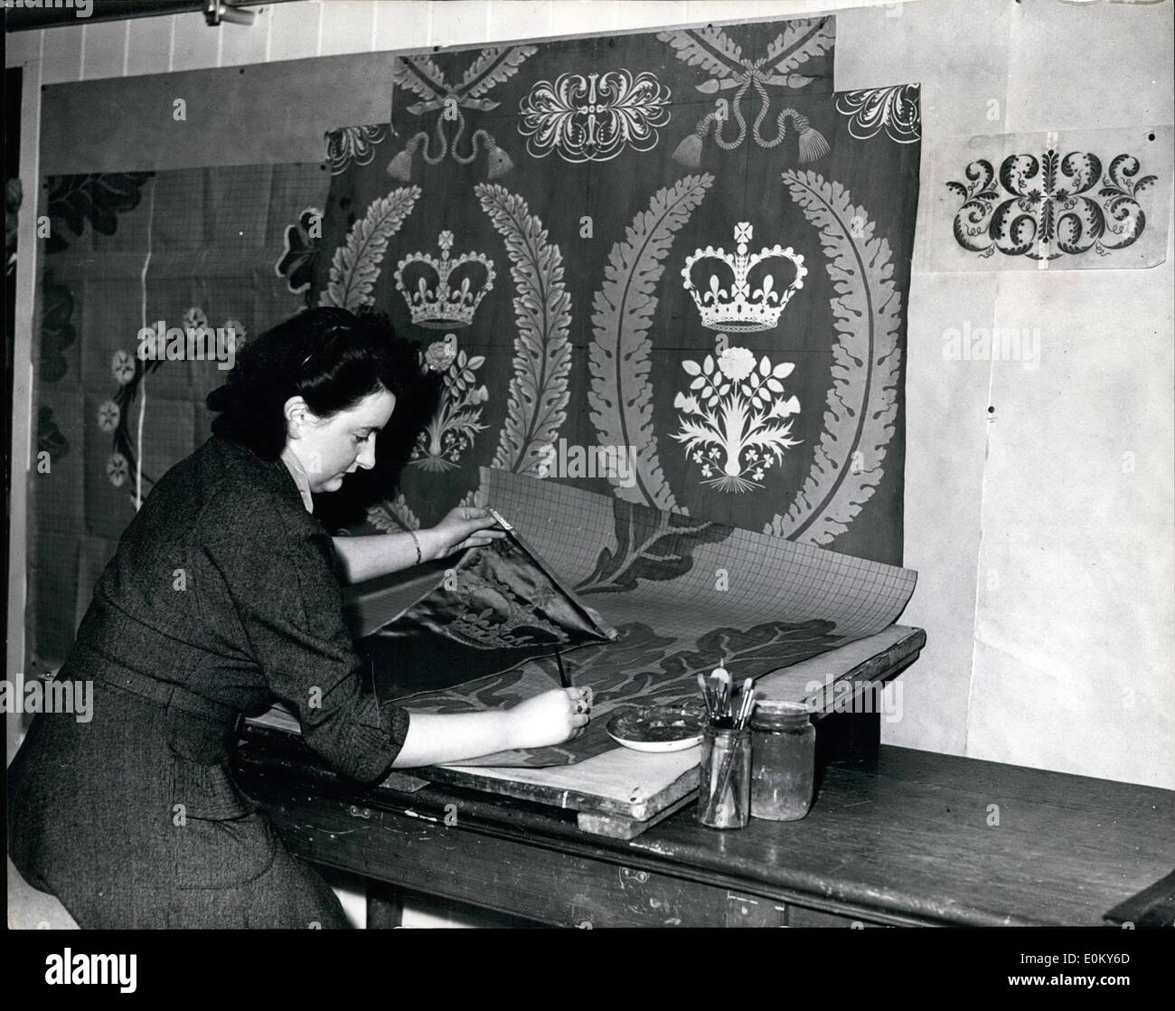 Nov. 11, 1952 - Experimenting on Silk Fabrics for Coronat Ion Hanging in Westminster Abbey: Work is in progress at Mesers. Warmer & Sons, Braintree, Esex - experimenting on the weave for a silk fabric in rich design for the covering of a large parts of Westminster Abbey, during the Coronation ceremonies..Mesers. Warners are producing the special velvet for the Queen's Coronation Robes.. Photo shows Draughting designs for the new material today - is June Swindells of Braintree- at the factory. Stock Photo