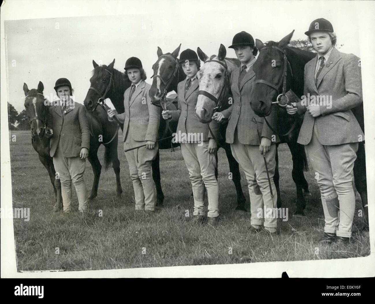Nov. 11, 1952 - Five Riding sisters. The five riding daughters of Mr. and Mrs. J.D.Aysh, of Hardham, near Pulborough, Sussex, won 162 prizes and trophies during the Gymkhana and horse show season - and have now started riding with the hunts. Photo shows (Left to right) Sonia, aged 11, with, ''Wendy'', Laraine, 14, with ''Joe'' , veroniga, 15, with ''Black Patrick''; Rosalie, aged 17 with ''Stell'' and Diana, 19, with ''Rosette'', seen yesterday before exercising their horses. Stock Photo