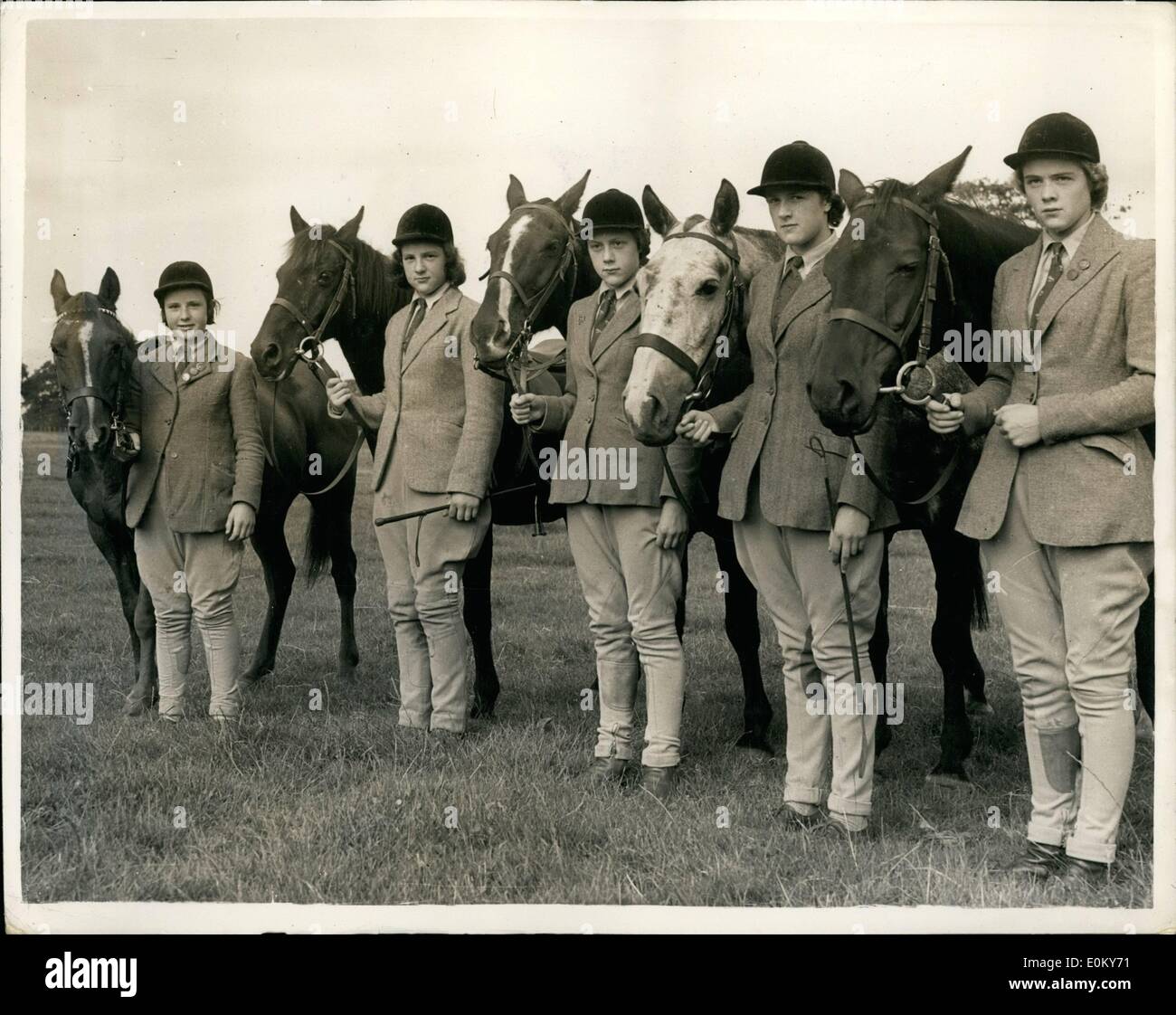 Nov. 11, 1952 - Five Riding Sisters: The five riding daughters of Mr. and Mrs. J.D. Aysh, of Herdham, near Pulberough, Sussex, won 162 prizes and trophies during the Gymkhana and horse Show season- and have now started riding with the hunts. Picture Shows: (Left to Right): Sonia aged 11, with ''Wendy'', Laraine, 14, with ''Joe'', Veronica, 15, with ''Black Patrick'', Rosalie, aged 17 with ''steel'' and Diana, 19, with ''Rosette'', seen yesterday before exercising their horses. Stock Photo
