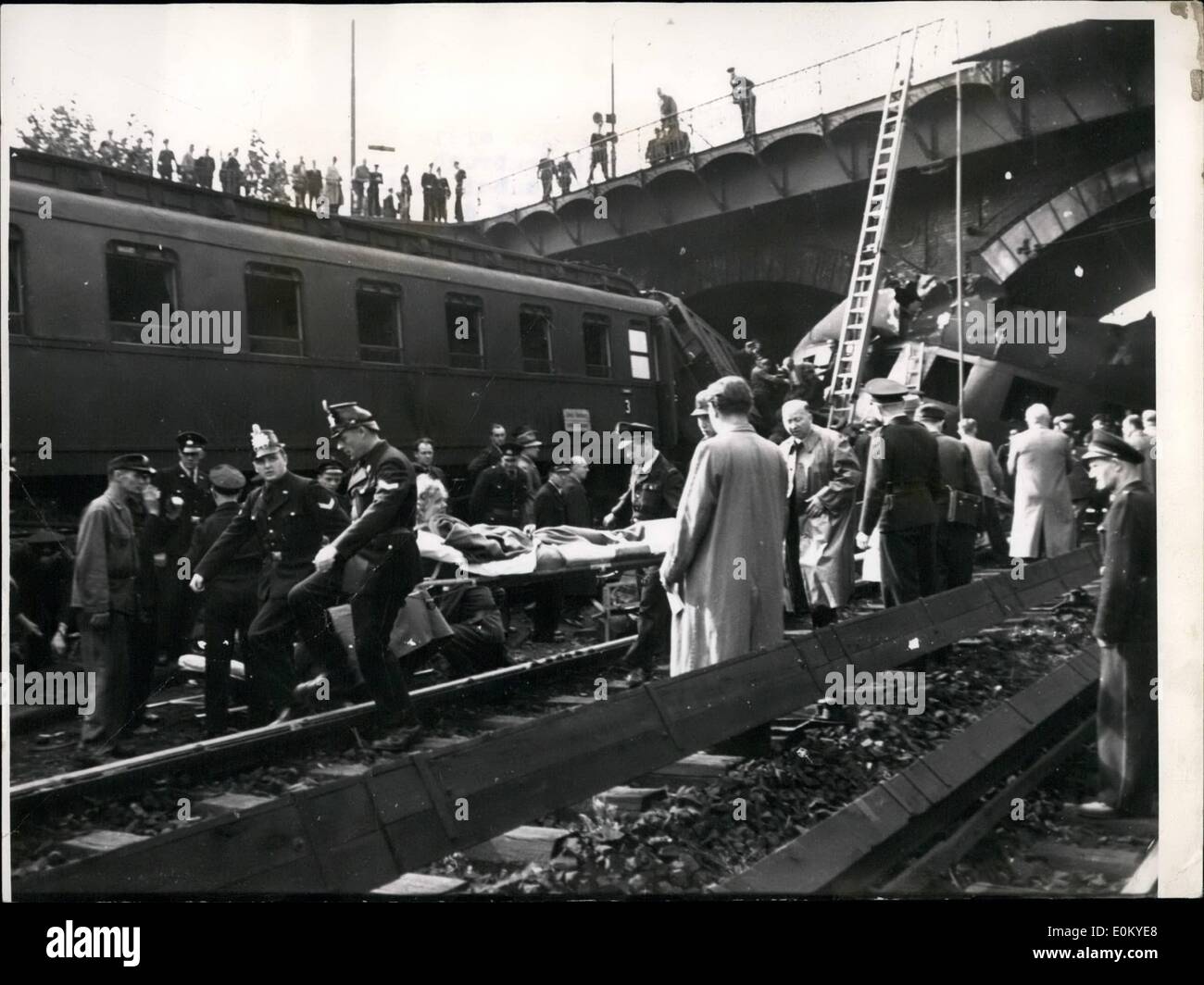 Sep. 09, 1952 - Nine Killed In Rail Crash Near Hamburg Thirty-Two Injured.. Nine passengers were killed and 32 seriously injured when an express train from Luebeck to Hamburg - was derailed near Hamburg Station... The first coach left the rails and broke into two against a bridge... Keystone Photo Shows:- The scene after the crash near Hamburg Station. Stock Photo
