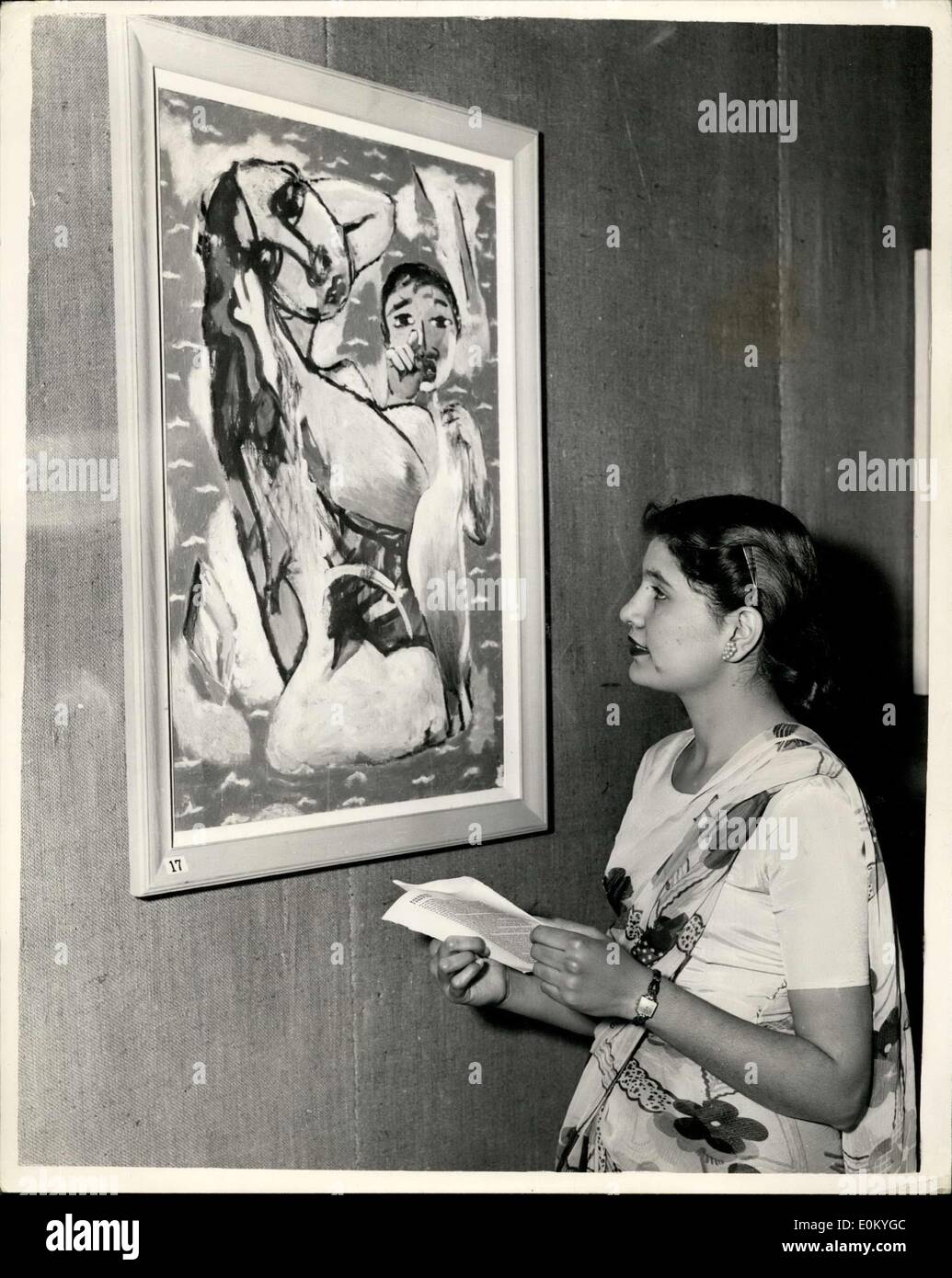 Nov. 25, 1952 - Exhibition of Ceylonese Paintings: The Royal India Pakistan and Ceylon Society Exhibition of Contemporary Ceylonese painting - opens today at the Imperial Institute Art Gallery. Photo shows Miss Voe Sharma, on Indian girl art student Who lives in Nairobi, Kenya, and who is now studying at the Nielsen Art School -seen admiring a painting entitled ''Bathers Surprised' by Justin Paris Doraniyagala. Stock Photo