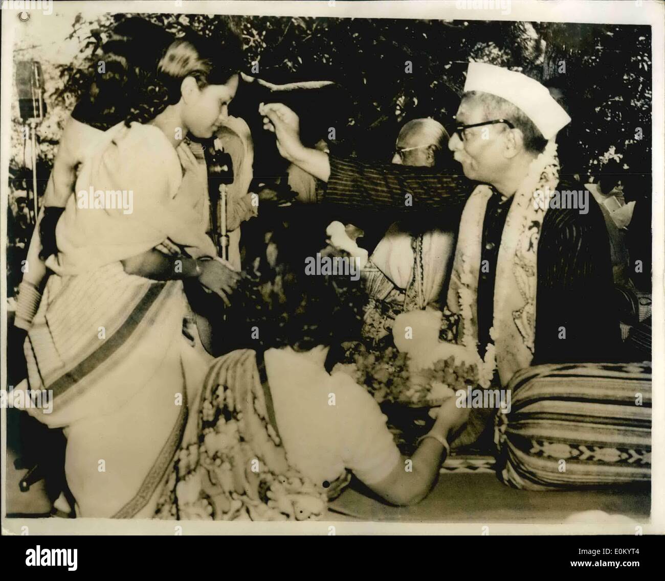 Dec. 12, 1952 - INDIAN PRESIDENT CONFERE DEGREE TO GIRL STUDENTS Dr RAJENDRA PRASAD, President of India, seen as he confers a degree on a girl student at the Convocation at Viswa-Bharati University, at Santiniketen, West Bengal, recently..The University was founded by the famous Indian post Rebindra Nath Tagore. Stock Photo