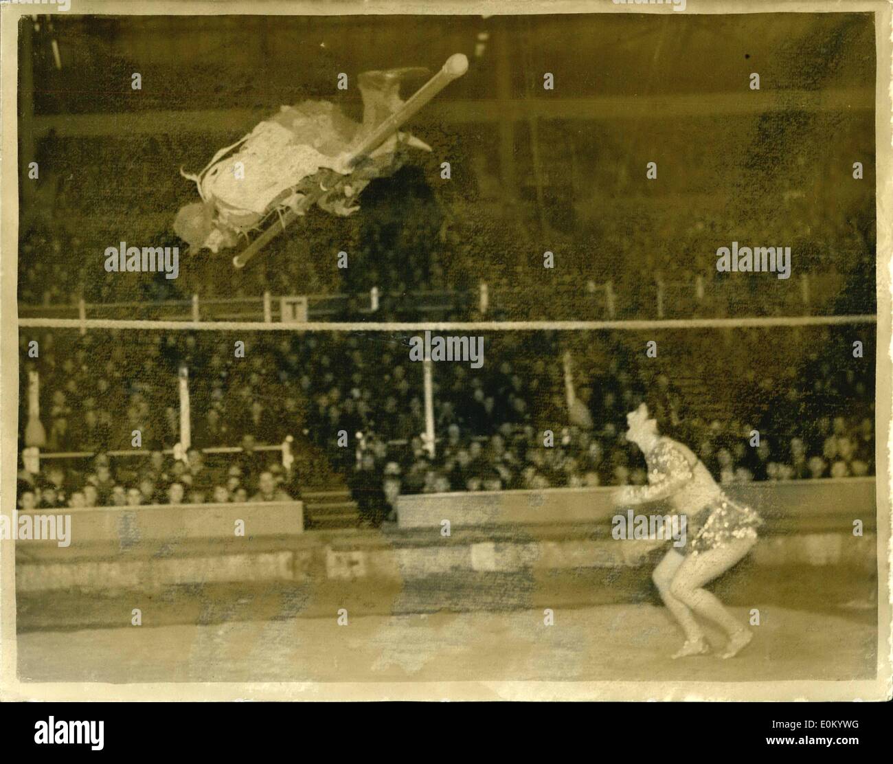 Dec. 12, 1952 - Six Thousand children go to the circus.. The ''Hobo'' Has A go.. Photo shows: An amusing incident in the Bertram Mills Circus - at Olympia this afternoon during the performance specially for children. As the ''Hobo'' - Emilio Zavatta and Rosita perform Stock Photo