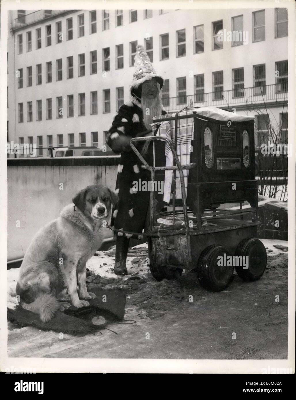Dec. 18, 1952 - Banished from the Russian zone: Otto Lemke, with his dog and barrel organ, have been expelled from the Russian Zone of Berlin, because his music hinders the people who have work to do. So Otto is now making his music in West Berlin. Photo shows Otto Lemke, and his St. Bernard Dog ''Waldo'' seen with his organ Russians don't appreciate fin music. Stock Photo