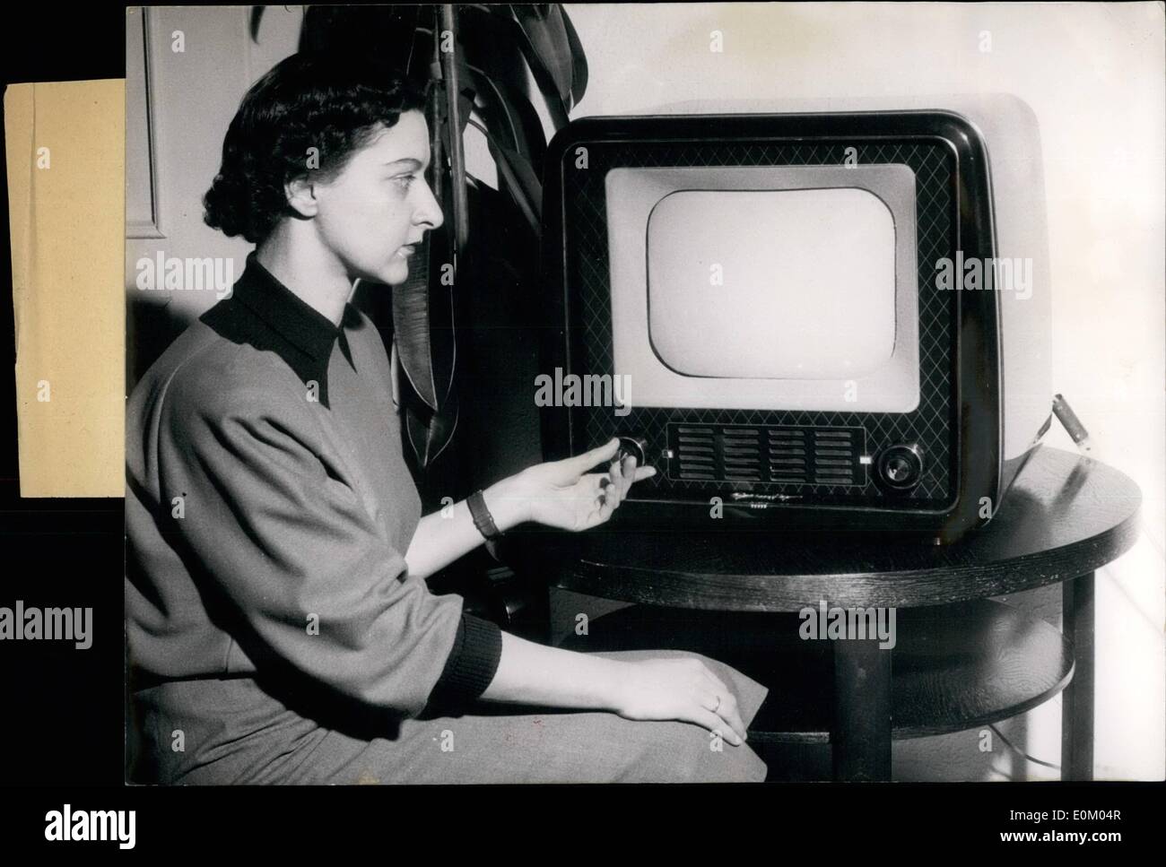 Feb. 02, 1953 - Television becomes cheaper! The new Grundig television set which will go in serial manufacture from February 28th, 1953 will cost two Marks less than 1000.--DM, i.e exactly 998. - DM. It is Germany's cheapest table-television set which will also make television much more popular to the lower classes by its relatively low price. The set has one channel-selector for 12 television channels, phase synchronisation, built-in antenna and automatic sound regulation. Stock Photo