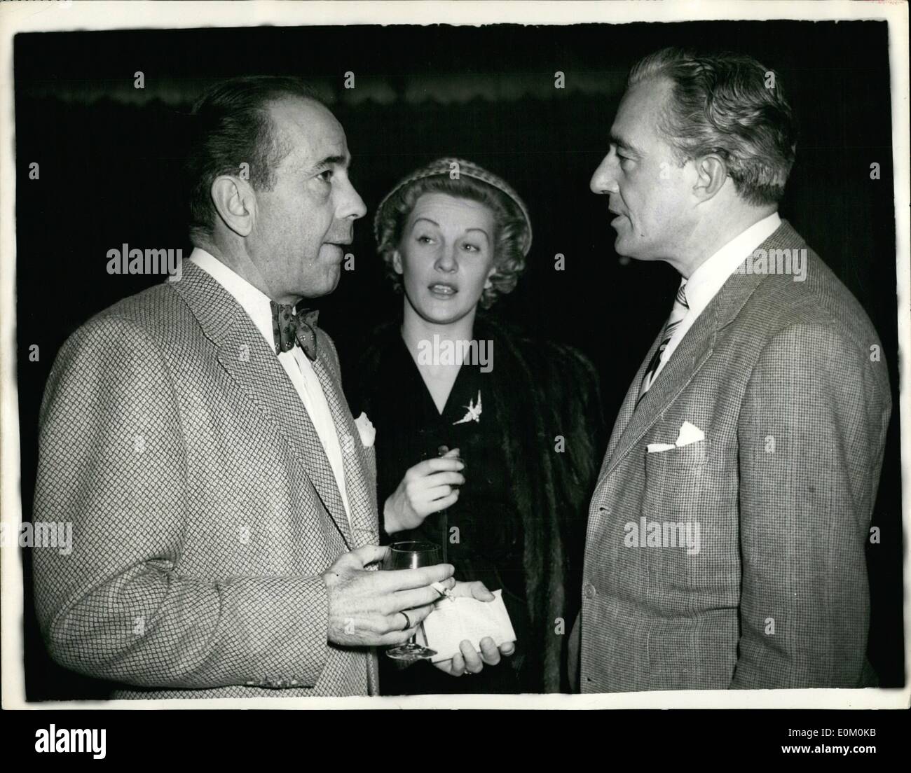 Jan. 01, 1953 - Italian Film Actor and Director in London: Vittorio De Sica, the Italian film actor and director - he directed ''Hiracle in Milan'' - arrived in London today. Photo Shows Vittorio De Sica seen chatting to Anne Crawford and Humphrey Bogart, at a press reception today. Stock Photo