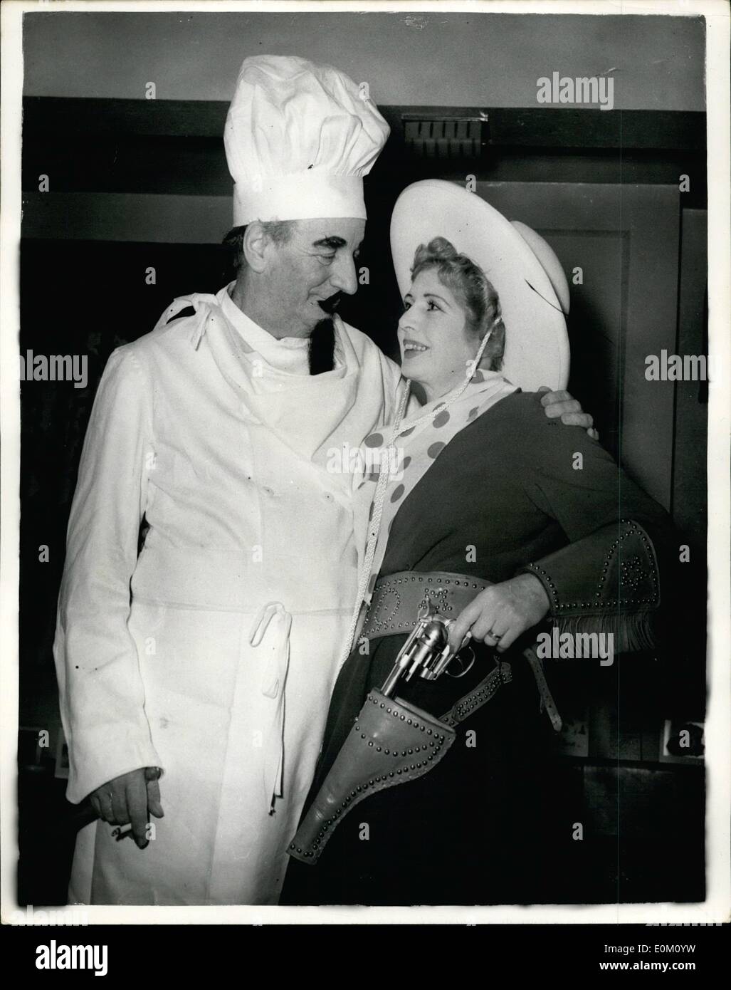 Jan. 01, 1953 - 1.1.53 Sir Bernard and Lady Docker in fancy dress. Photo Shows: Two ideas for the kind of fancy dress with which to welcome the New Year. A chef's costume of gleaming white overalls and tall hat, moustache and beard, and a Western outfit complete with cap-firing gun. The wearers, at Poole Harbour Yacht Club's ball last night were Sir Bernard and Lady Docker. Stock Photo
