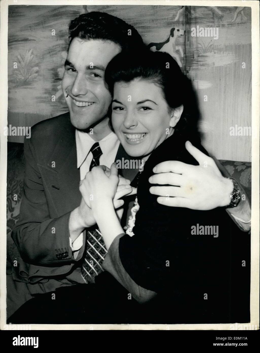 Jan. 01, 1953 - New Romance for Joan Rice. Miss Joan Rice, 22-year old waitress turned film star photographed last night with her fiance, 19-year old Mr.David Green. When she returned from the Fiji Islands two months ago she denied that she had broken her engagement to Mr. Martin Boyce - but last night she revealed her engagement to Mr. Green whom she met at a Christmas party. He was public schools heavy weight champion before leaving Harrow, and is now a film salesman traveling for a Hollywood company in England. Stock Photo