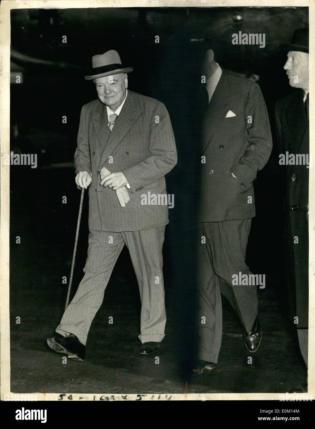 Feb. 30, 1953 - 30-2-53 Prime Minister returns to London by air from his holiday near Nice. Sir Winston Churchill, who has been spending a holiday at Lord Beaverbrook's villa at Cap D'Ail, near Nice, returned to London by Air this evening. Photo Shows: Sir Winston Churchill walking across the tarmac after arriving by air at London Airport this evening. Stock Photo