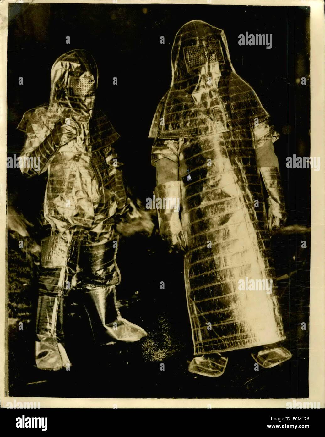Jan. 09, 1953 - 9-1-53 They look like men from Mars. Suits of aluminum foil for fire protection. Looking rather like men from another world are these firemen in Munich Germany as they try out suits made of an aluminum foil which gives complete protection in fires of a great heat. If successful, the suits are expected to be issued for all fire fighting in Munich. The material from which the suits are made is as thin as cigarette papers. Stock Photo