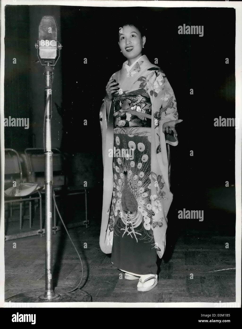 Mar. 03, 1953 - A Japanese Butterfly Makes B.B.C. Recording For Japanese Service: A Madam Butterfly who really is Japanese has arrived in London. She is Michiko Sunahara from Tokio. She has been singing the role of Cho-Cho-San in Madame Butterfly for the past 18 months at the Opera Comique in Paris. Miss Sunsbar, at 28, one of Japan's leading sopranos, sings Madam Butterfly in Japanese and speaks little English. But her French is perfect. This evening she made a B.B.C. recording for the Japanese service. Photo shows Miss Sunahara pictured making her B.B.C. recording this evening. Stock Photo