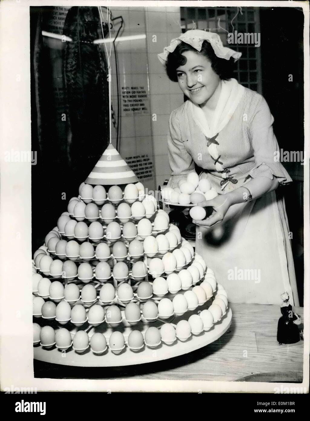 Mar. 03, 1953 - Press view of the ideal home exhibition. Photo shows:- Doris Korod, 24, from Bornholm, Denmark, wearing Danish dairymaid costume, who is over here specially for the ideal home exhibition,fitting up a display of Danish eggs, at the Olympia, where the exhibition opens tomorrrow. Stock Photo
