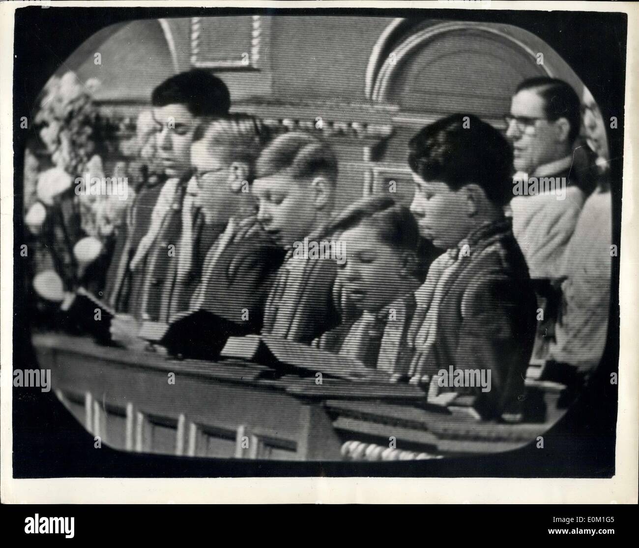 Mar. 26, 1953 - TV Millions see choirboys sing in Queen Mary's chapel. Millions Mary televised direct from the Queen's chapel in Marlborough house. Never before have viewers been taken into a royal home in mourning. It was done with the queen's personal permission. under the same roof, in another part of Marlborough house, lay queen Mary . often she had prayed in the chapel. Photo shows In Queen Mary's chapel the chair lead the service which had no congegation except the viewers. This picture appeared on the TV Screens. Stock Photo
