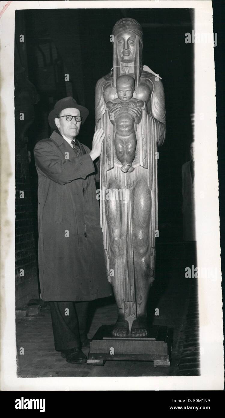 Mar. 03, 1953 - Sending - in day for sculpture at the academy. Exhibit by artist of ''Gog and Magog'' fame.: Photo shows Mr. David Evans who lives in Weleymn Garden City - with his wood carving in Barmese Task entitles ''Mother and Child'' arriving at the Royal Academy this morning. Mr. Evans - who comes from Manchester (originally) is the artist who worked on the new production of ''Gog and Magog'' which are to replace these ruined by bombs - at the Guildhall. Stock Photo