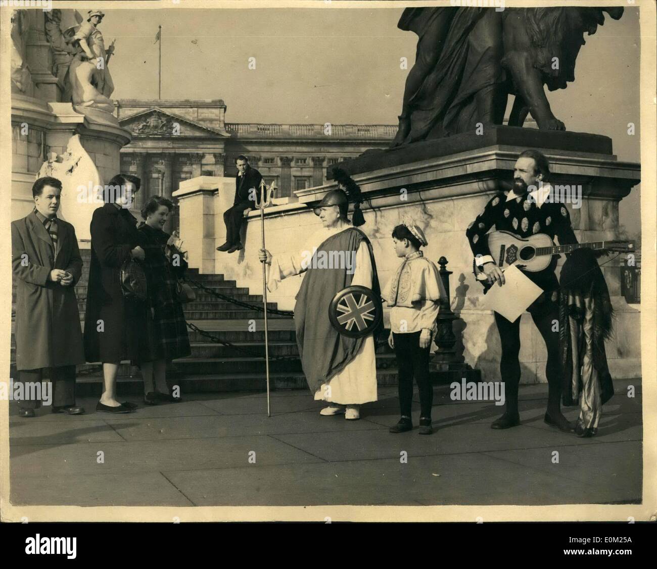 Apr. 04, 1953 - Shakespearian Actors Serenade Buckingham Palace in Honor of the Queen's Birthday. A party of Shakespearian Actors under the leadership of G. Francis J. Stanislaw went to the Victoria Memorial outside Buckingham Palace this morning for the purpose of Serenading the Palace. in honor of the Queen's Birthday. Keystone Photo Shows: G. Francis J. Stanislaw as Duke of Vienna ; Mrs. A.F. Stanislaw as Britanna and Nicholas Shaw as The Child Hamlet . watched by onlookers as they Serenaded on the Memorial today. Stock Photo