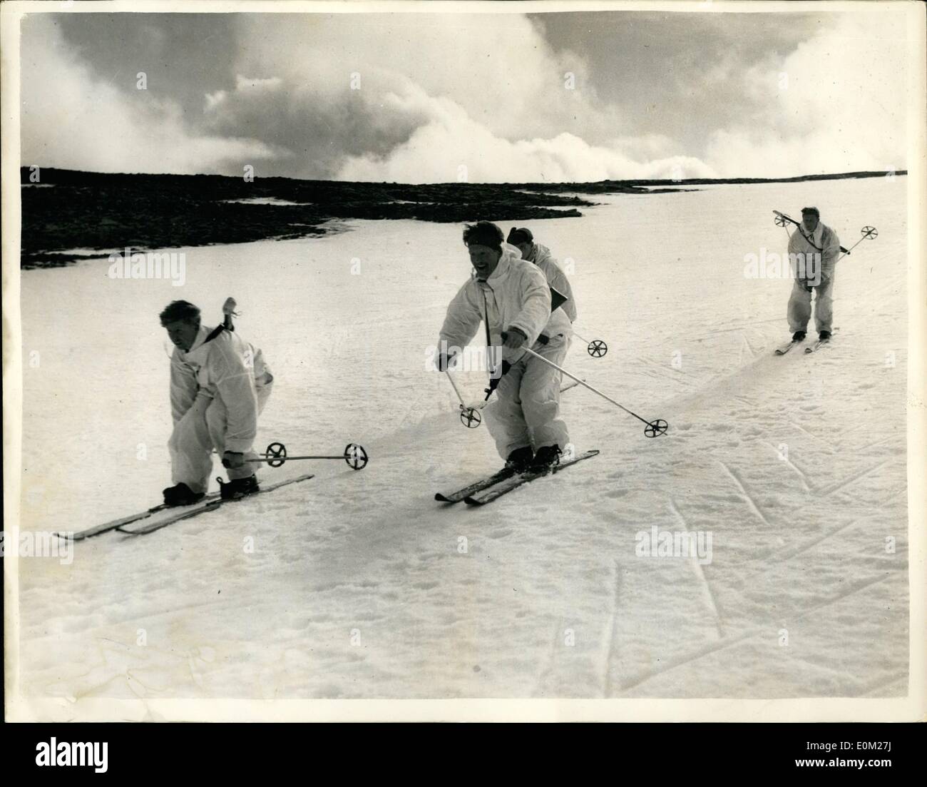 Mar. 03, 1953 - Marine Commando Winter Warfare Training Course. In The Cairngorm Mountains Of Scotland: The bitterly cold summit of the Cairngorm Mountains - of Scotland is the setting for a training course in Winter Warfare - for a  of Commandoes of the Royal Marines. Photo shows A ski patrol - complete with snow suits - sets off on an exercise over the Cairngorm plateau led by Army Ski Champion Colour Sgt. Broadman (centre) Stock Photo