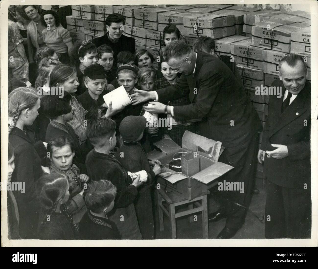 Mar. 03, 1953 - 'C.A.R.E.' Package Distributed to Refugee Children in Berlin. Keystone Photo Shows: The scene as Dr. Richard P. Stock Photo