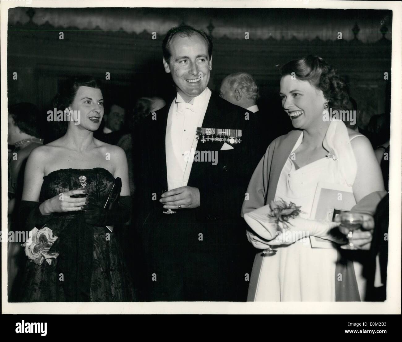 Apr. 04, 1953 - AVIATION JUBILEE BALL AT THE DORCHESTER HOTEL.... NEVILLE DUKE ATTENDS.... An Aviation Jubilee Ball in aid of the Air League of the British Empire was held last night at the Dorchester Hotel.... Many well known personalities were present... Keystone Photo Shows:- Left to Right:- Mrs. Neville Duke, Neville Duke, the well known test pilot, and Mrs. Beaumont pictured at the Ball last night. Stock Photo