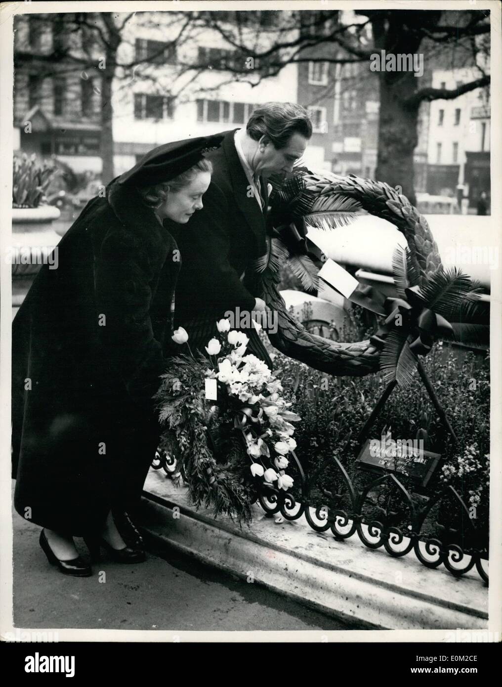 Apr. 04, 1953 - Shakespeare's Day Wreath Placed on Statue in Leicester Square. For the first time William Shakespeare's birthday was marked in London today by the placing of a wreath at the statue of the bard in the centre of Leicester Square. Mr. Donald Wolfit, the actor, laid the wreath sent by the American National Theatre and Academy. this Anglo American gesture marks the 389th anniversary of Shakepeare's birthday. Photo Shows: Mr. Donald Wolfit and his wife laying the Wreath on Shakespeare's statue in Leicester Square this morning. Stock Photo