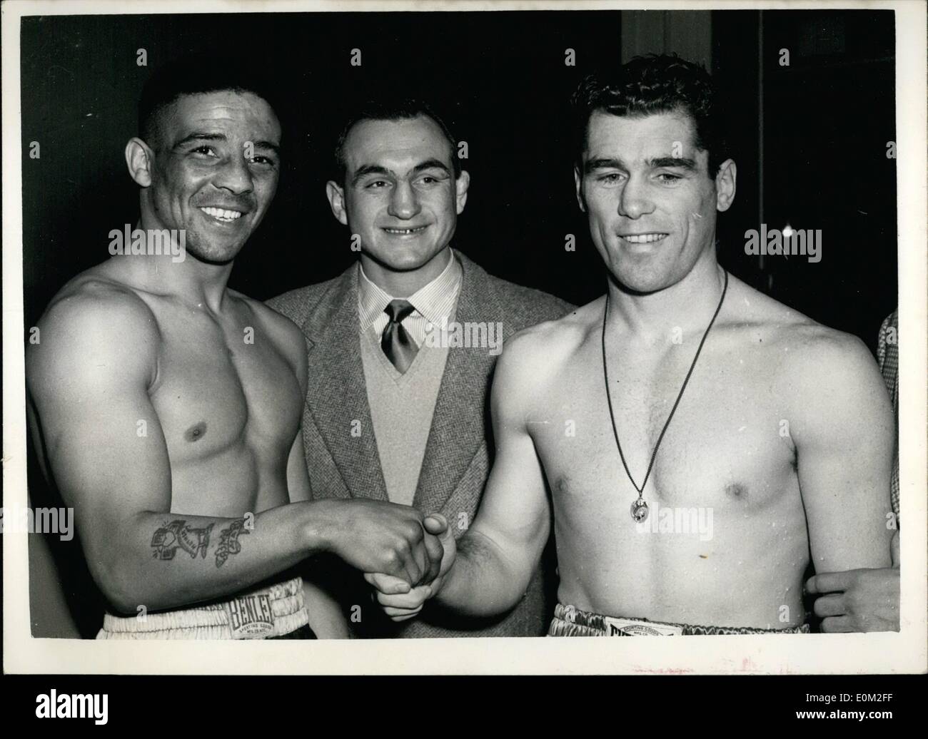 Mar. 17, 1953 - 17-3-53 Cartier and Turpin weigh in at Solomons Gym, Humez looks on. Walter Cartier, the American Mystery man and Randolph Turpin weighed in at Solomon's Gymnasium this afternoon for their contest tonight at Earls Court. Keystone Photo Shows: Randolph Turpin (left); Charles Humez, the French Champion and contender for World Middleweight Title; and Walter Cartier on right, after the weigh in this afternoon. Stock Photo