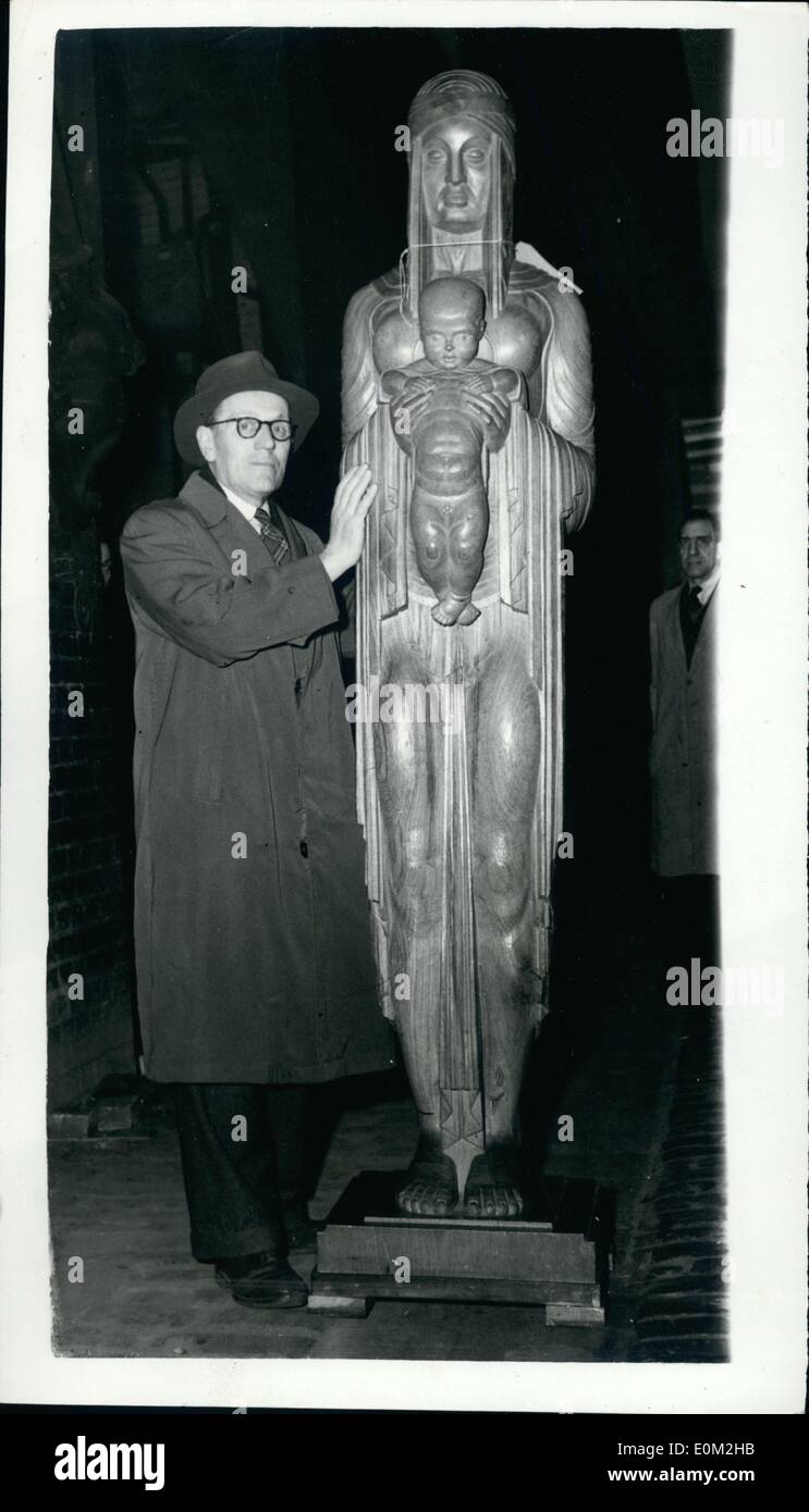 Mar. 24, 1953 - Sending-in Day for Sculpture at the Academy. Exhibit of ''Gog and Magog'' Fame.: Photo shows Mr. David Evans who lives in Welwyn Garden City - with his wood cerving in Burmese Tesk entitled ''Mother and Child'' - arriving at the Royal Academy this morning. Mr. Evans - who comes from Menchester (originally) is the artist who worked on the new productions of ''Gog and Magog'' which are to replece these ruined by bombs - at the Guildhall. Stock Photo