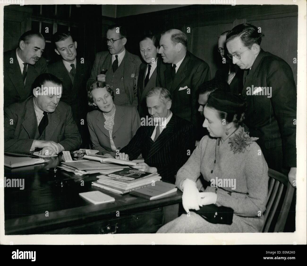 Apr. 04, 1953 - B.B.C. Commentators have Coronation Conference: The first conference of the B.B.C. Commentators who will take part in the Coronation broadcast - was held this evening at Broadcasting House. Photo shows (L to R) during the conference are (sitting): Howard Marshall; Audrey Russell; Max Muller, head of sound outside broadcast; Willie Richardson, and Jean Metcalfe. (standing) John Snagge, G. Tonkin, liaison assistant of outside broadcasting Dept.; Frank Anderson, Manager of outside broadcasting; Henry Riddell, Frank Gillard; Rex Austin and Allen Williams. Stock Photo