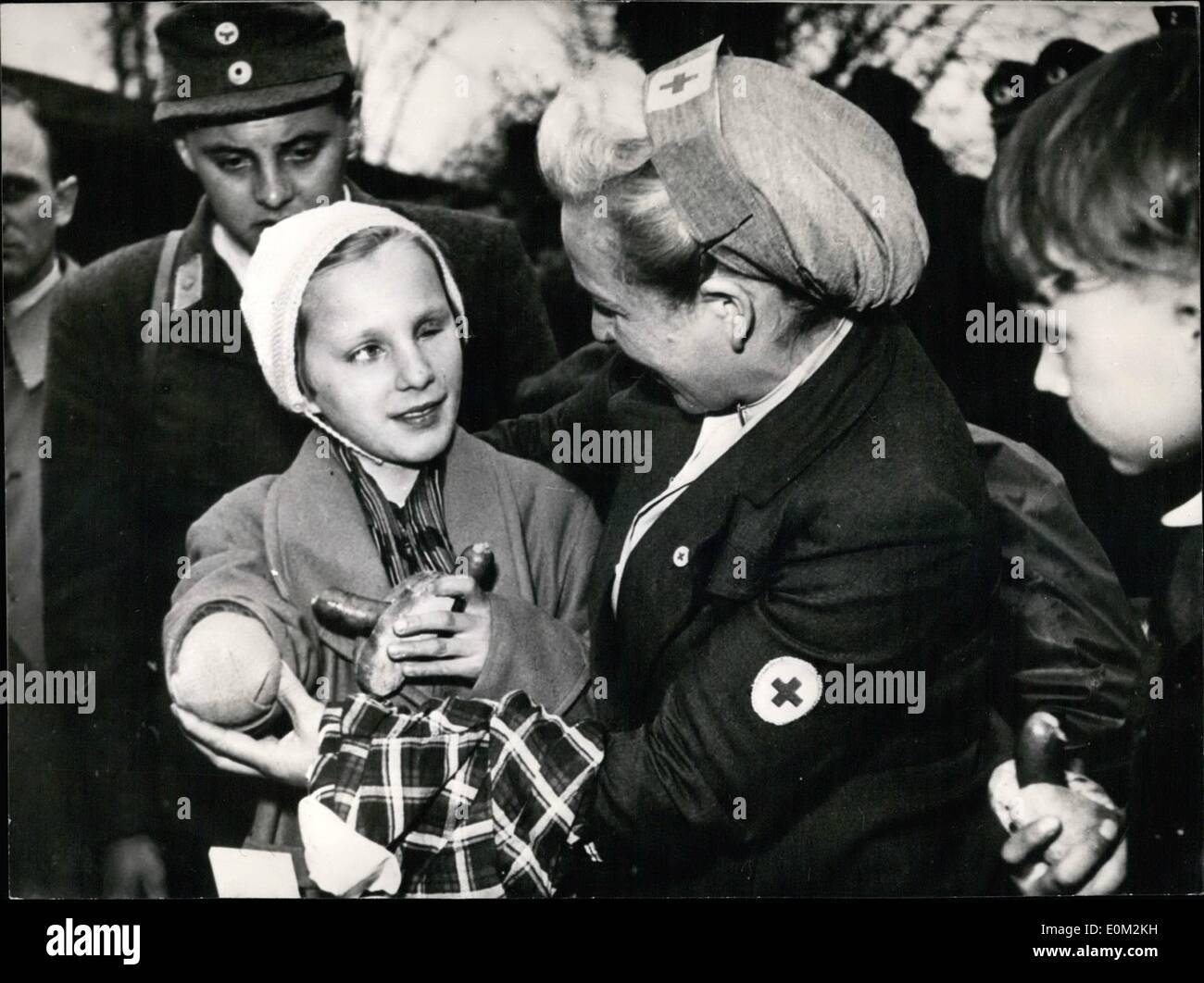 Apr. 04, 1953 - Seven German Children Back from Czechoslovakia! After separation from more than 6 years, seven German children were reunited with their parents on Wednesday, April 15th by the regular train Prague-Schirnding-Paris. At the frontier check and control point Schirnding these little kids were welcome by personal of the Red Cross and the over happy parents. When German Citizen were expelled from Czechoslovakia after unconditional surrender all kids were forced to remain with their relatives in Czechoslovakia Stock Photo