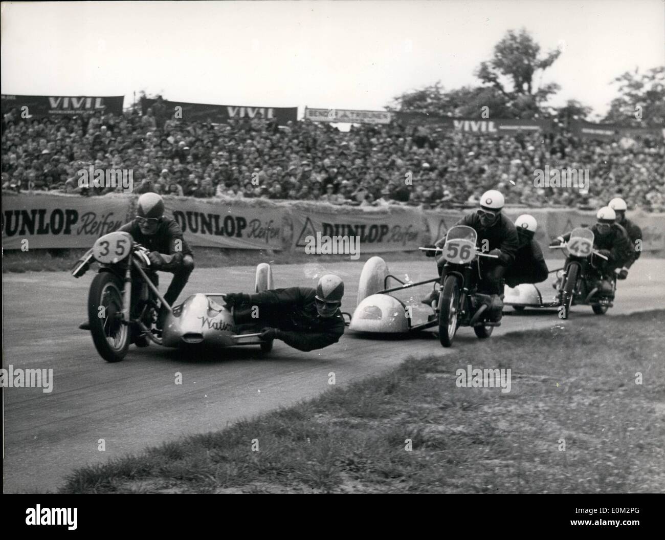 May 05, 1953 - The most interest race on Hockenheimring near Mannheim was the race of the 500 ccm sidecar-motorcycles. The Englishman Eric Oliver (left) won with the breath of a tire before Wiggerl Kraus (Munich) (middle). Third was Noll (right) Stock Photo