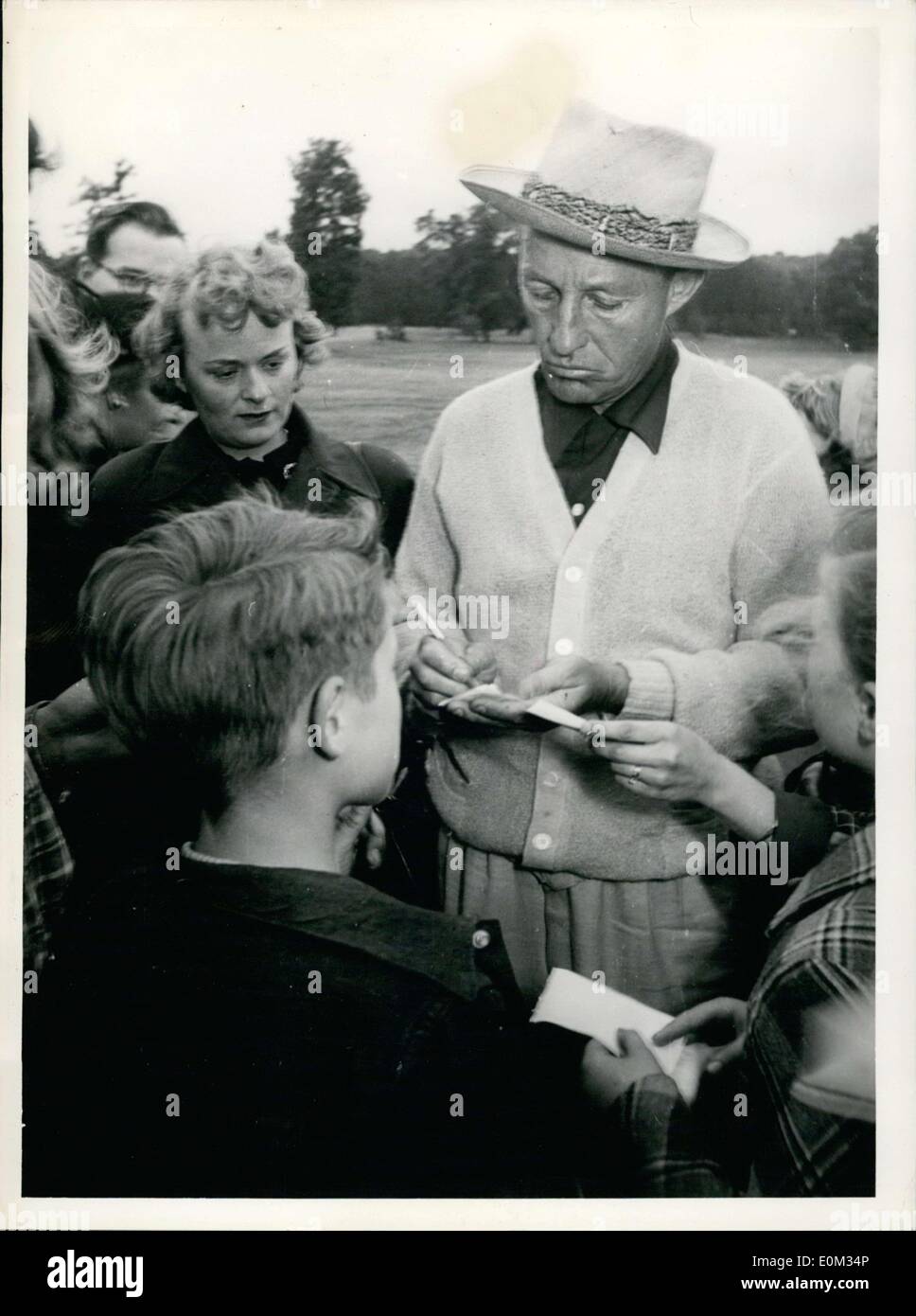 May 28, 1953 - Bing Crosby is pictured here, grimly signing autographs on a Frankfurt golf course. He actually wanted to just play golf, but fans kept coming up to him and asking for autographs that he eventually stopped. Stock Photo