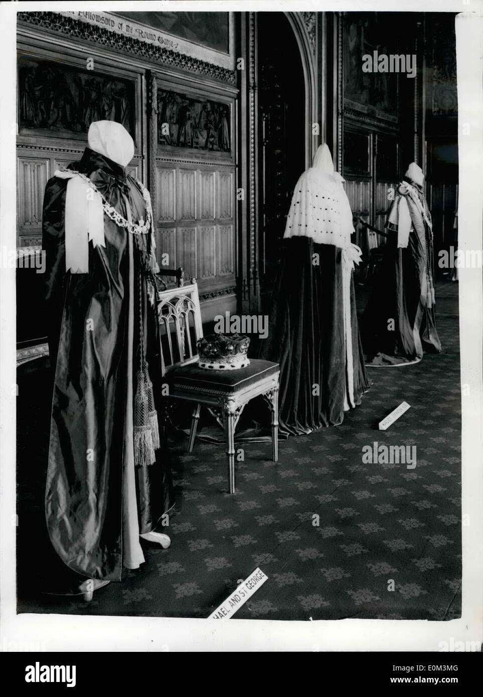 May 05, 1953 - Roses ad Insigna on Show at house of Lords.: Some of the exhibits on a show at the exhibition of robes and insignia which has opened to the public at the Royal Robing Room, House of The Lords. From left to right are : The order of St. Micheal and St. George, in Royal Blue; the coronation robe of a Merquess, in red and ermins, with the Coronet (on chair); and The Royal Victorian Order with red edginge and gold tassel. Stock Photo