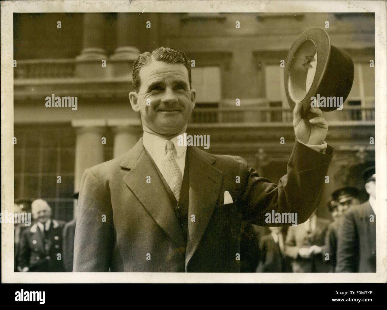 Jun. 06, 1953 - Sportsmen Knights Receive The Accolade: Champion jockey Gordon Richards and retired cricketer Jack Hobbs were among the record number of newly created knights to receive the accolade from H.M.the Queen at Buckingham Palace today. Photo Shows: Champion jockey Sir Gordon Richards waves his hat as he leaves Buckingham Palace this afternoon. after being knighted by H.M. The Queen. Stock Photo