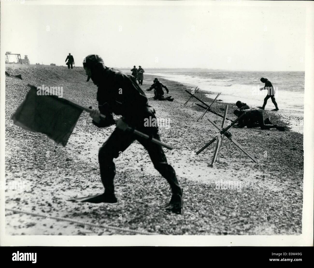 May 05, 1953 - Three services ''invasion'' demonstration: A powerful invasion force made up of Royal Marines and units of the Regular and Territorial Army including a battalion of the Gloucestershire Regiment, were put ashore from ships of the Royal Navy on the beaches at Eastney, Southsea, in the course of ''Demonstration Ruethnicund IV''. The exercise has been planned to illustrate the entite technique of amphibious assault from the preliminary reconnaissance stages, through the attack against prepared defence positions to the ultimate consolidation of ground won by the invaders Stock Photo