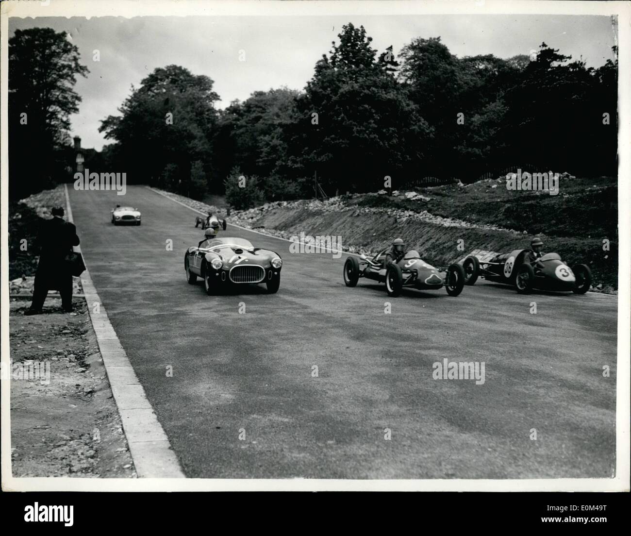 May 05, 1953 - Motor Racing Practice At Crystal Palace: Arrangements are going a head at the Crystal Palace motor racing track preparation for the first meeting on Whit Monday, May 25th, which is being organised by the British Automobiles Racing Club. The construction of the new link section of the track to exclude the inner loop is now completed. Several racing cars were at speed today, testing the new circuit. Photo Shows A group of racing cars seen at speed coming down the new fast approach to the finishing line - on the new circuit at Crystal Palace today. Stock Photo