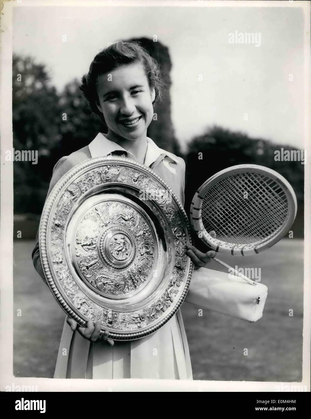 Jul. 04, 1953 - 4-7-53 Maureen Connolly wins Ladies Championship. Poses with the trophy. Keystone Photo Shows: Maureen Connolly of the United States poses with the trophy after she had beaten fellow countrywoman Doris Hart to win the final of the Ladies' Singles Championship at Wimbledon this afternoon. Stock Photo