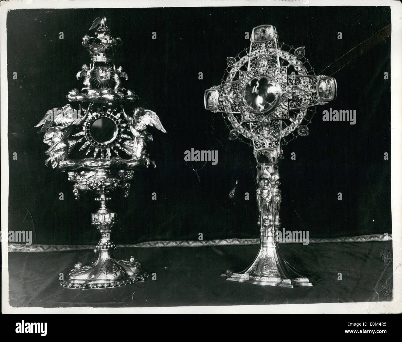 Aug. 08, 1953 - WESTMINSTER CATHEDRAL TREASURES TO BE PLACED ON EXHIBITION: Members of the public will have the opportunity of seeing the treasures of Westminster Cathedral for the first time - when they are placed on exhibition this month Keystone Photo Shows:- Two of the treasures to be exhibited: 'Left : A monstrance, Flemish. Antwerp mark 1669. Maker Jean Maermans. Large silver gilt monstrance, centre jewelled with garnets, acquamarines, crystals and almandine garnets. The crown set with Cabochon emeralds. (Right): Monstrance. Maker, Omar Ramsden Stock Photo