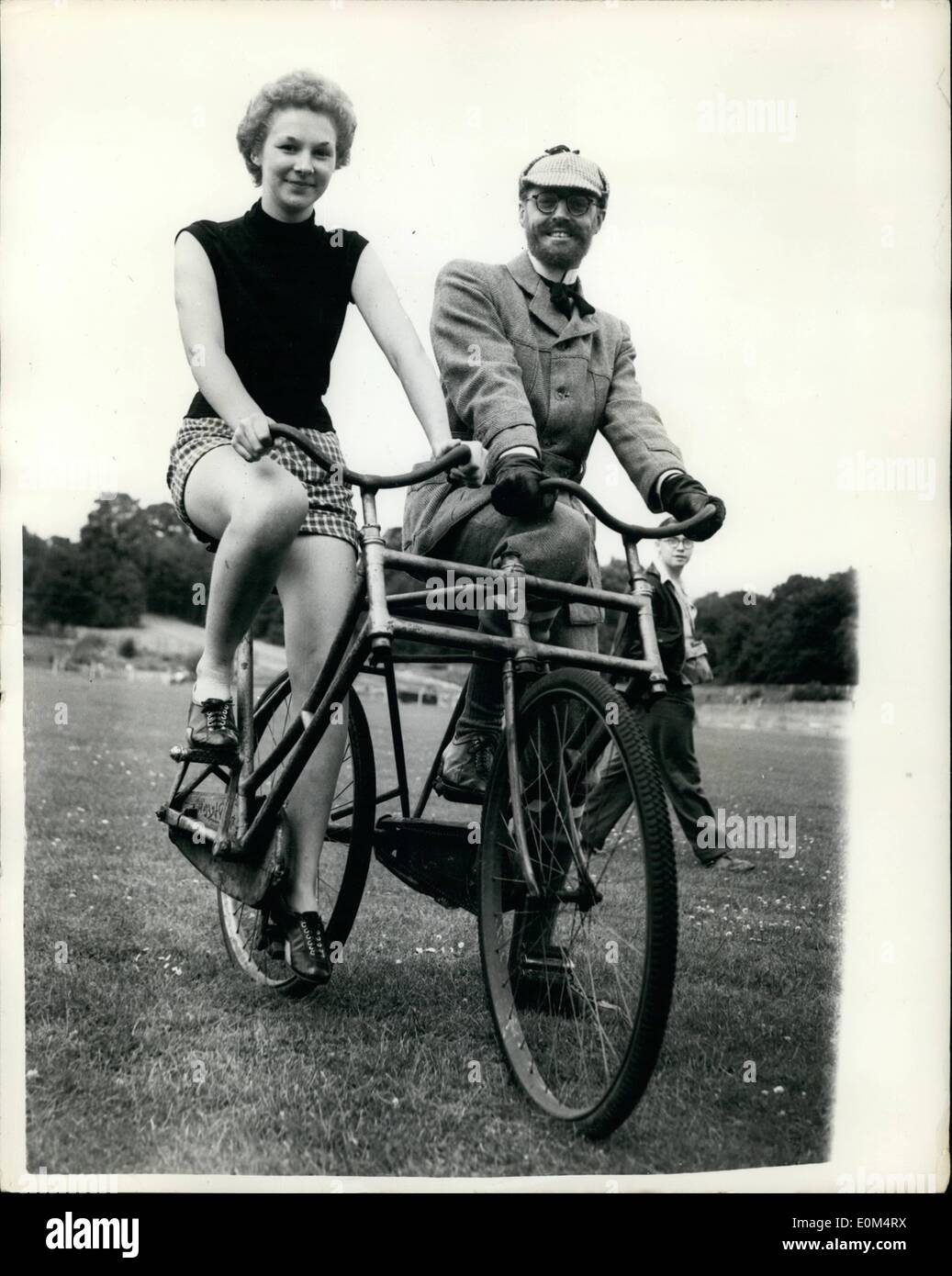 Aug. 08, 1953 - CRYSTAL PALACE CYCLING FESTIVAL... TWO ON A TANDEM. KEYSTONE PHOTO SHOWS: ROY HEAD of Chalk Farm accompanies JOSEPHINE BOHN (17) of Chingford on an 1893 ''Social'' Tandem - during the Crystal Palace Cycling Festival this afternoon. Stock Photo