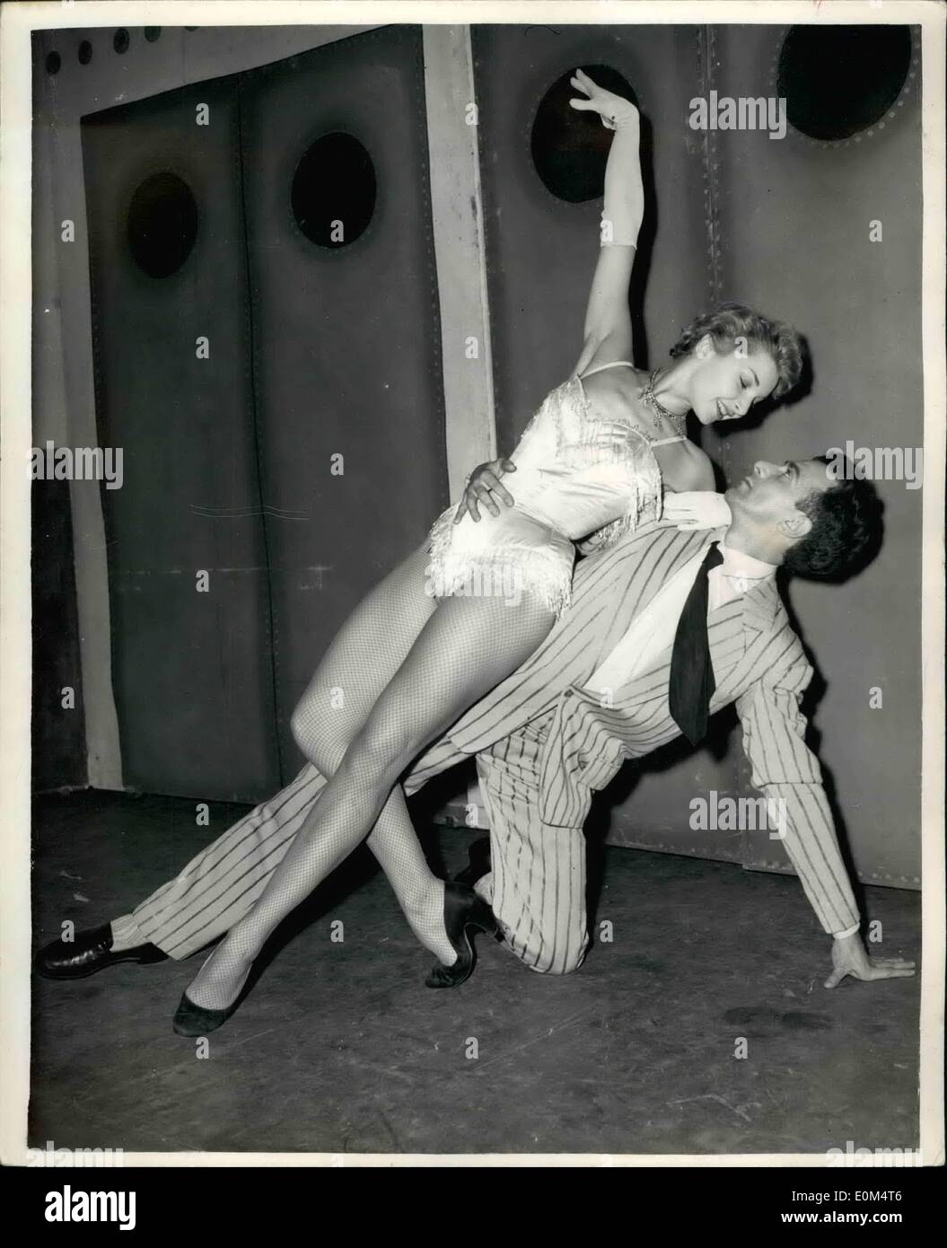 Aug. 08, 1953 - Dress rehearsal for Stoll ballet. Roland Petit's ''Ballets de Paris'' opens a five-weeks season at the Stoll Theater this evening. Roland Petit heads the company, which includes Collette Marchand, who was the star of the film ''Moulin Rouge''. Dress rehearsals were hold today. Photo Shows Colette Marchand and Roland Petit, seen during today's rehearsal of the ballet ''Cine-Bijou'' -at the Stoll theater. Stock Photo