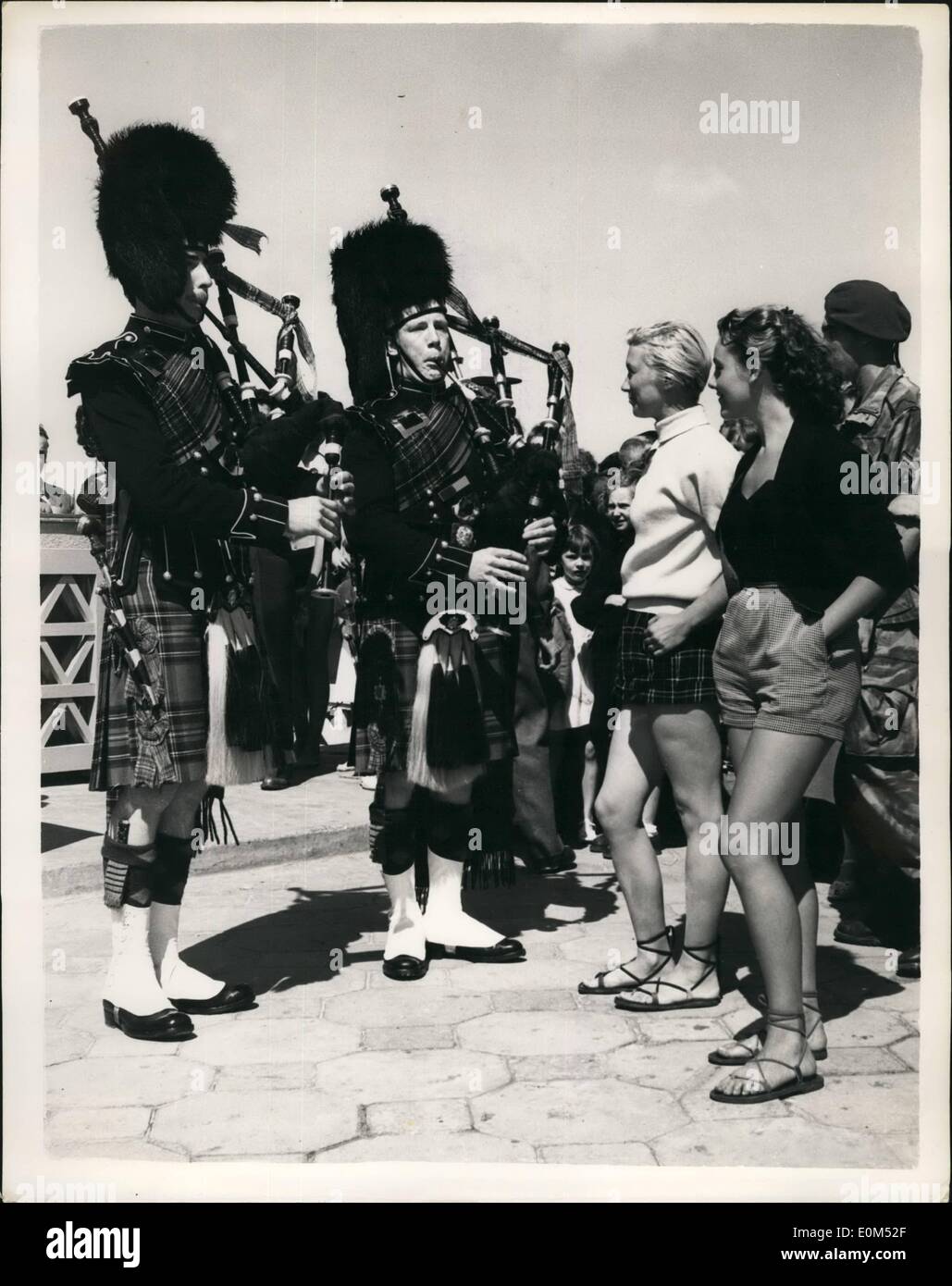Aug. 08, 1953 - Scots Guards Entertained in Le Tourquet - And Do A Bit Of Entertaining Themselves: The French strikes were forgotten recently, when the townsfolk of Le Touquet spared nothing to entertain a detachment of Scots Guards - the regiment which helped in the liberation of the resort in 1944. Photo shows Kilted Pipers of the Scots Guards were a source of admiration by townsfolk of Le Touquet. Stock Photo