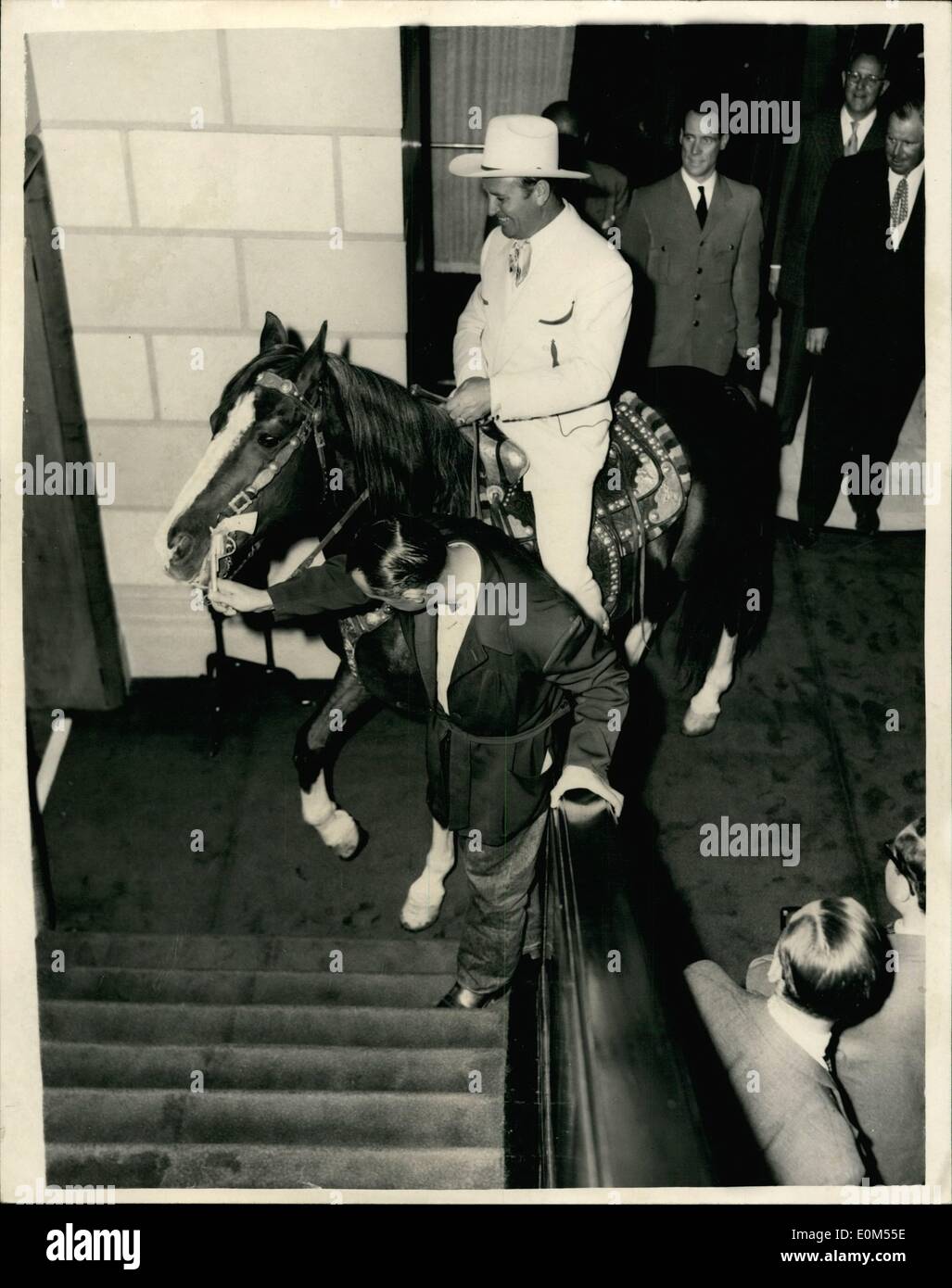 Jul. 07, 1953 - Champion goes to the press conference.. 21-7-53. Up the Stairs . not me. says Champion . Cowboy screen star Gene Autry took his horse Champion with him when he went to the press reception in their honour at the Savoyu this evening. Keystone Photo Shows: One of the stablemen tries to coax Champion . with Gene Autry up Ã¢â‚¬â€œup the stairs. but he would not go at the Savoy this evening. JSS/Keystone Stock Photo
