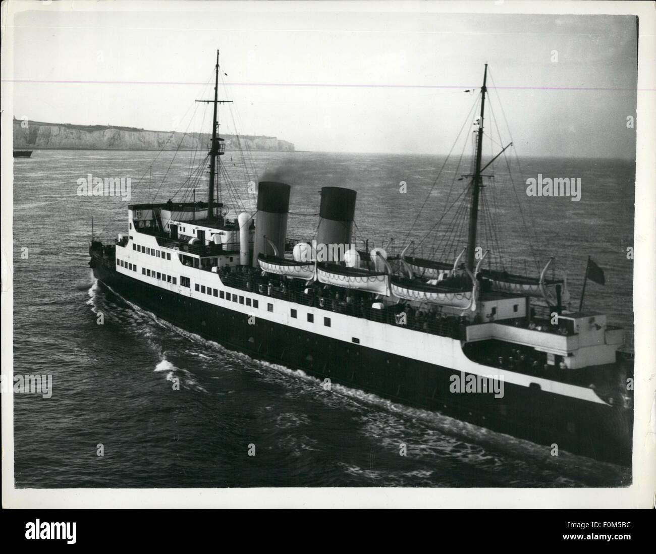 Aug. 08, 1953 - Home again. By ''Little Dunkirk'' Ship. The Channel steamer Dinard ploughs on towards the White Cliffs of Dover. Her decks are crowded with holiday makers. This was how they reached Britain in the week-end's non-stop shuttle service which rescued 35,000 Britons from strike-bound France. The ''little Dunkirk'' operation was completed at midnight last night. By then 20,000 had arrived at Victoria. Stock Photo