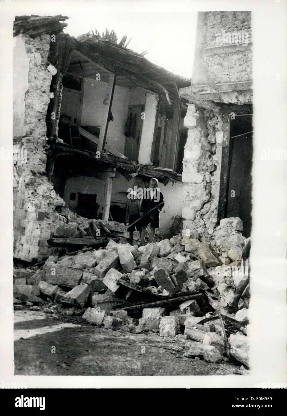 Aug. 12, 1953 - 12.8.53 400 killed in Greek earthquakes. At least 400 people have been killed and hundreds injured in three days of earthquake in the Greek Island of Cephalonia. Yesterday was the worst yet. Towns and villages were wrecked and many thousands were made homeless. Photo Shows: These two little children stand among the debris of their wrecked homes in the island of Cephalonia. Stock Photo
