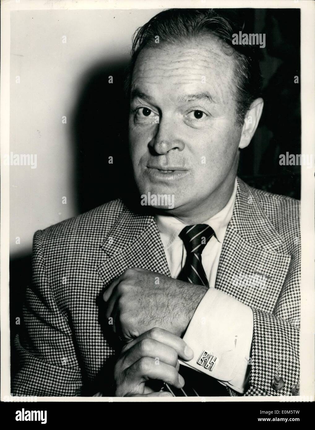 Sep. 08, 1953 - 8-9-53 Bob Hope and Gloria de Haven in London. Showing off his cuff-links. A reception was held Savoy Hotel this afternoon for American stars Bob Hope and Gloria de Haven who are to appear at the London Palladium. Keystone Photo Shows: Bob Hope points out his Bob Hope Cuff-links, during the reception at the Savoy this afternoon. Stock Photo