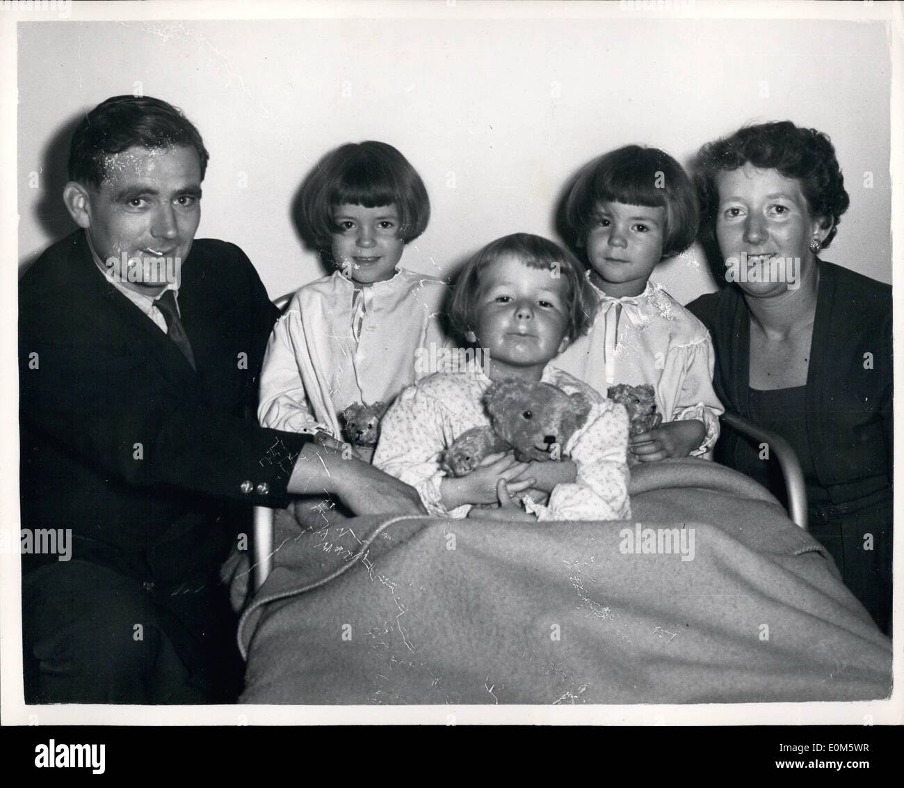 Sep. 09, 1953 - World Air Speed Pilot - With His Family. Mr. Colquhoun At Home: Lieut. Commander Mike (''Lucky'') Lithgow Vickers Supermarine Chief test pilot - is to make attempts on beating Sqd. Leader Neville Duke's world speed record, in Tripol next week. He will fly a Vickers Swift F.4. Jet fighter which was demonstrated at Farnborough last week. Before he makes his flights his co-test pilot Mr. Leslie Robert Colquhoun will make test runs over the course. Photo shows Mr Stock Photo